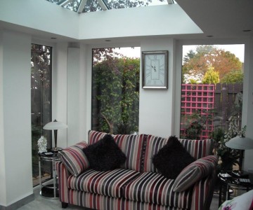 Striped sofa in a white orangery