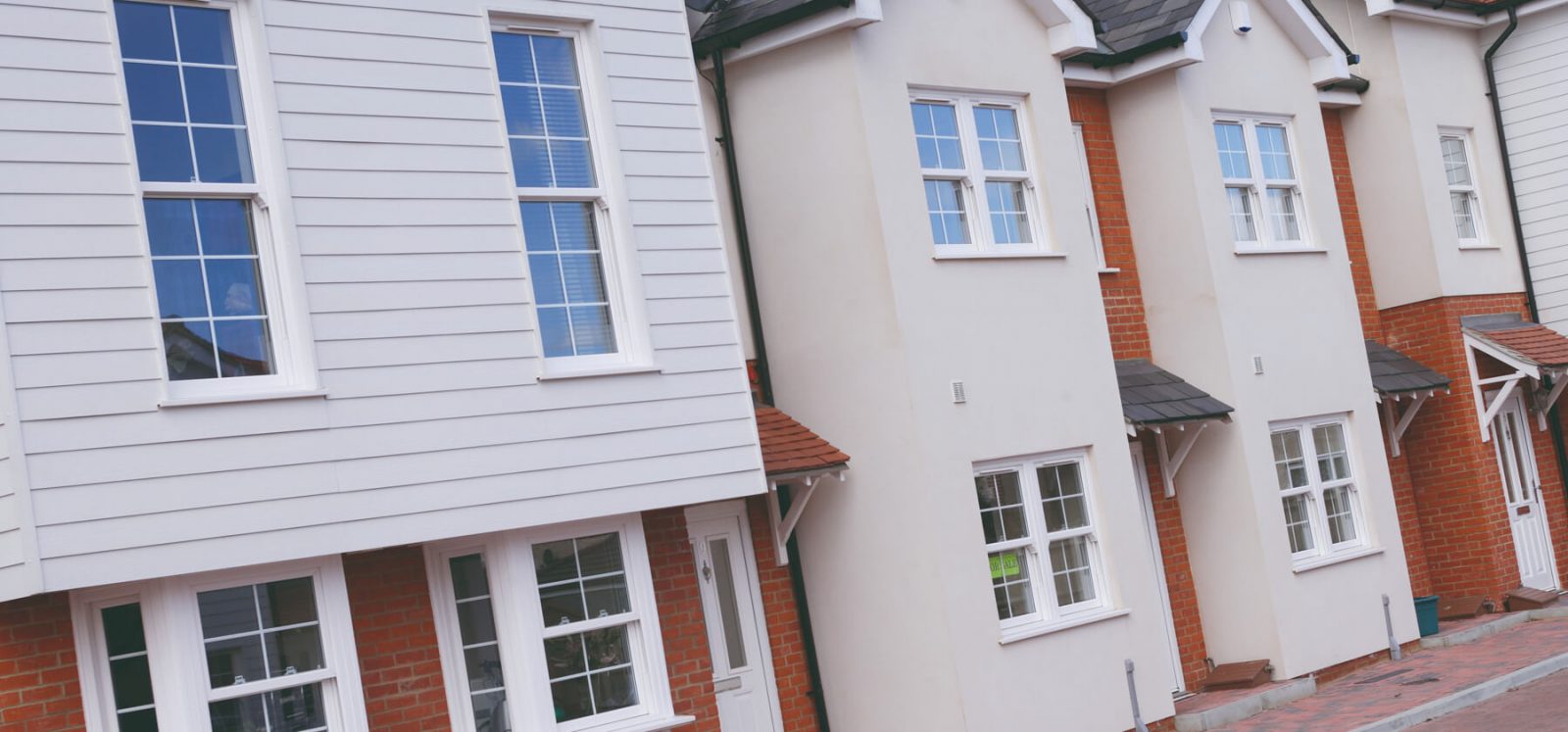White uPVC vertical sliding windows installation