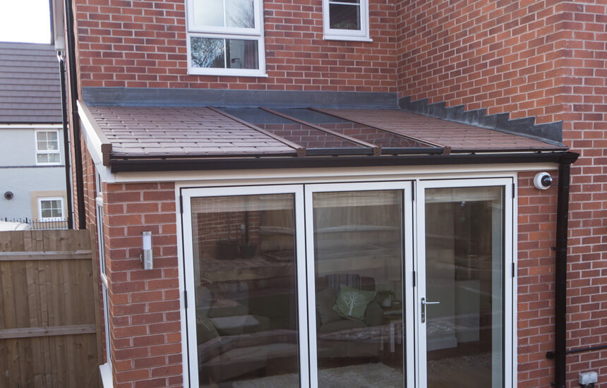 uPVC Lean to conservatory with a brown tiled roof