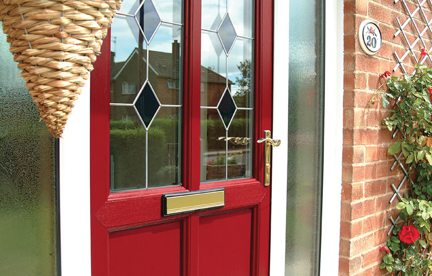 Red uPVC entrance door close up