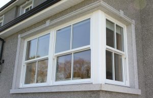 White sash windows on a house corner