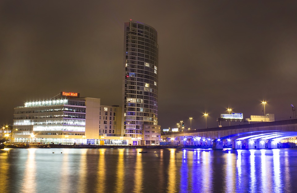 Belfast city at night with blue lit up sky