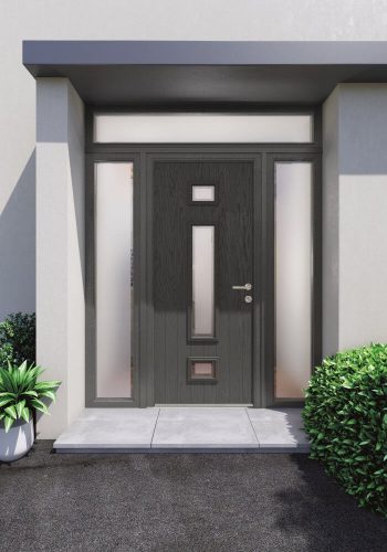 Black door with central decorative glazing and two sidelights and a toplight