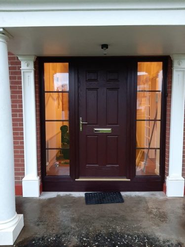 Finished brown front door installation