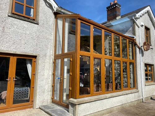 A timber front facing conservatory.