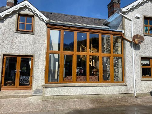 A timber front facing conservatory.