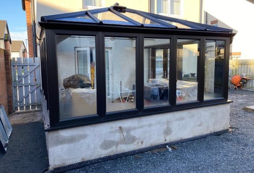 A black Upvc conservatory.