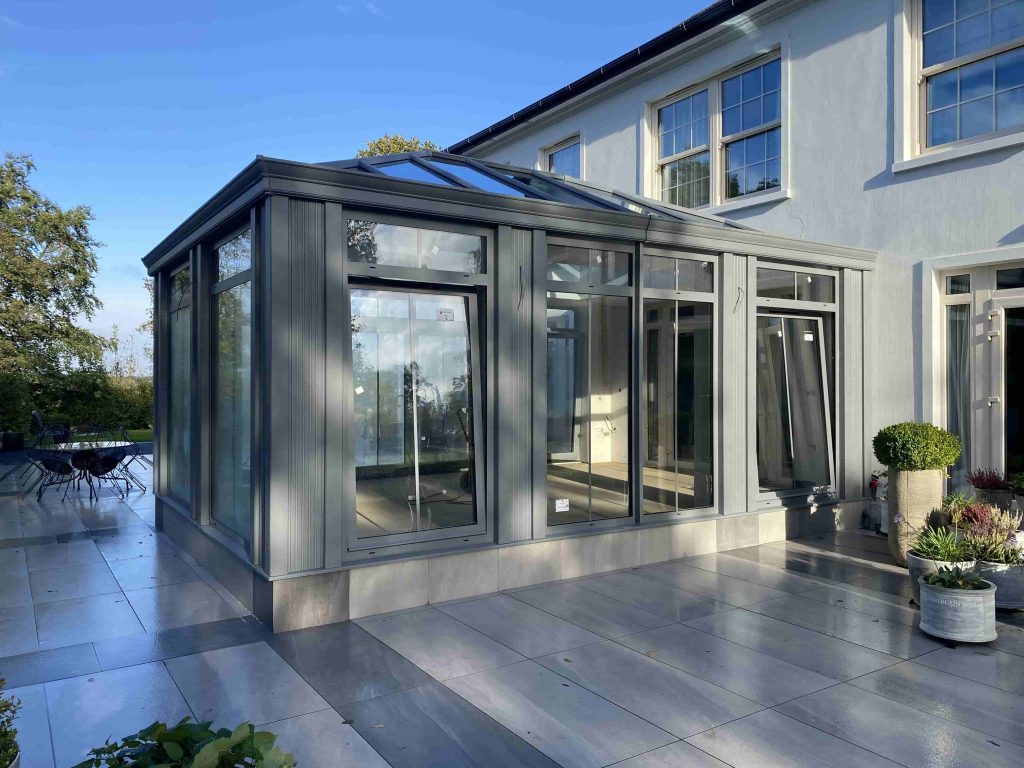 the outside of an aluminium bespoke grey conservatory installed by Turkington windows