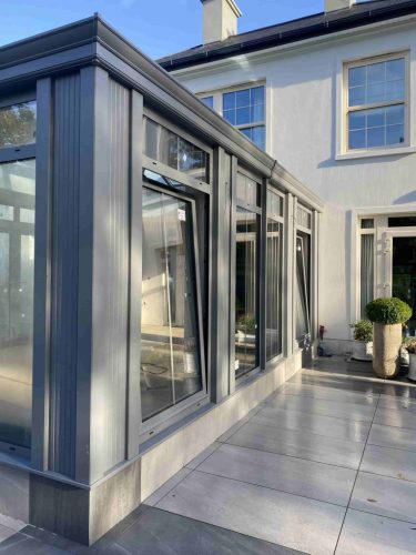the outside of an aluminium bespoke grey conservatory installed by Turkington windows