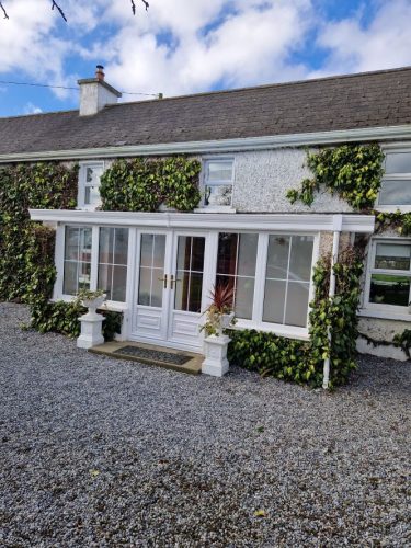 conservatory after - white upvc french doors and white upvc windows