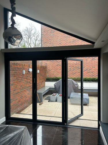 installation of bifold doors in progress