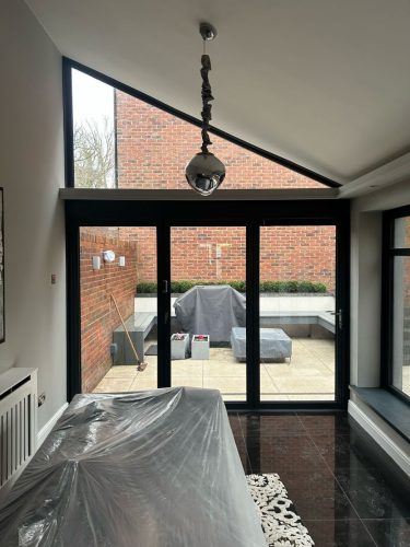 installation of bifold doors in progress