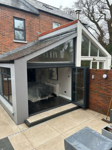 installation of bifold doors in progress