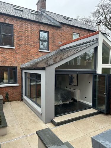 installation of bifold doors in progress