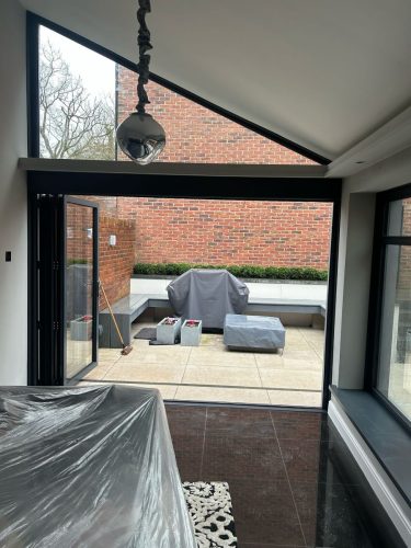 installation of bifold doors in progress