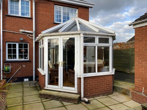 white upvc conservatory with polycarbonate roof - before