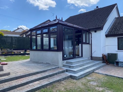 glass roof conservatory installation with sliding patio doors